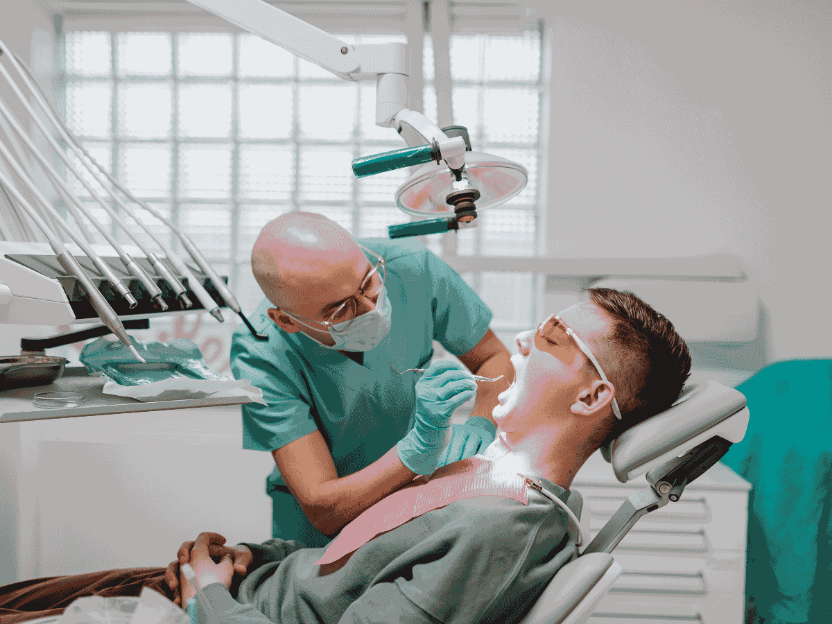 Australian dental practice surgery with dental chair, overhead lighting unit and specialised equipment
