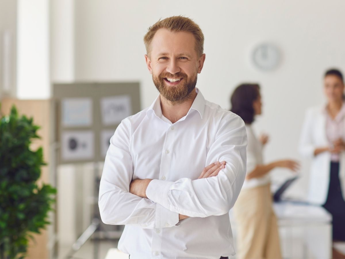 Commercial property investor reviewing portfolio with finance broker