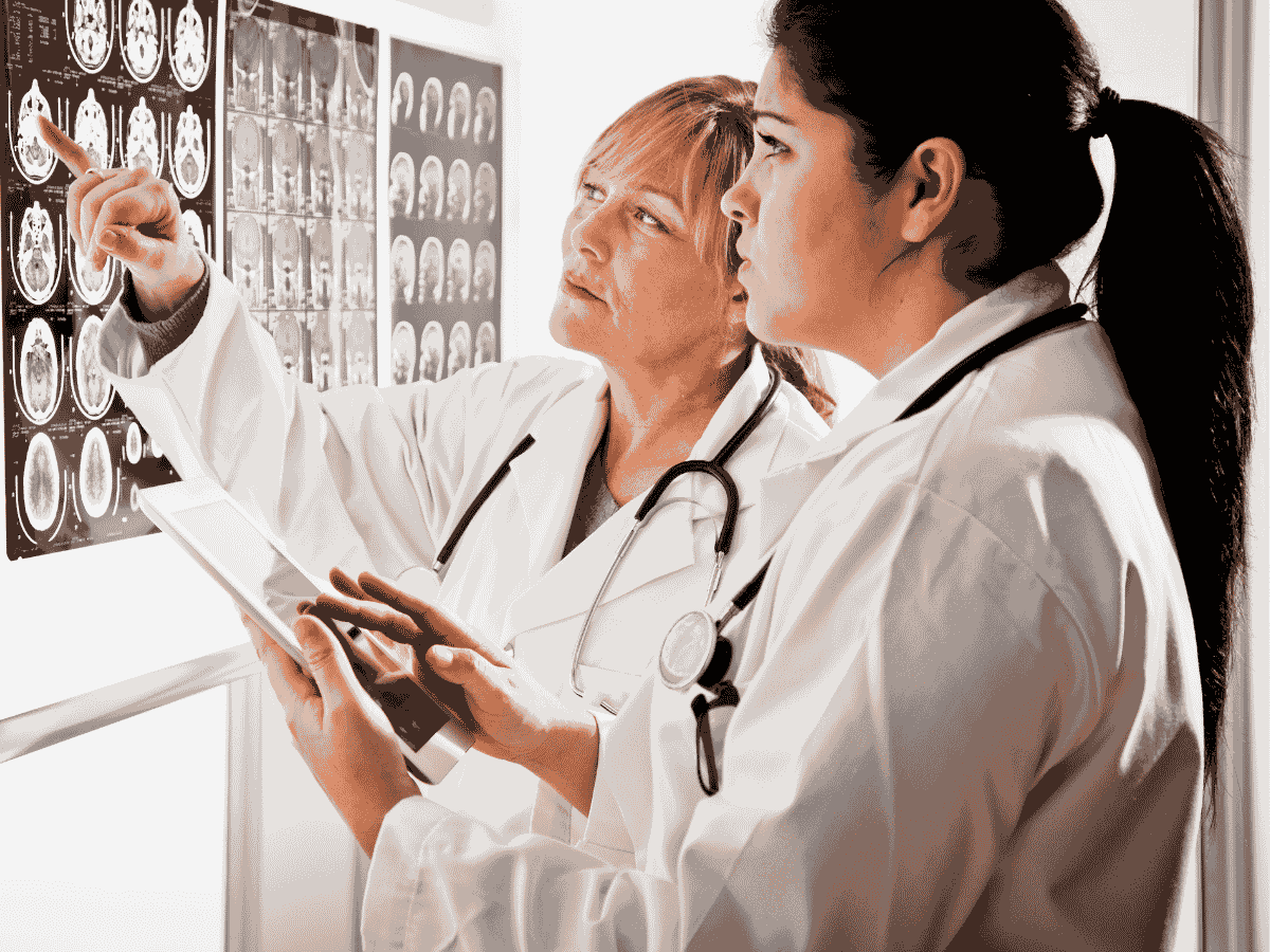 Medical specialist consulting suite in an Australian healthcare precinct with examination room