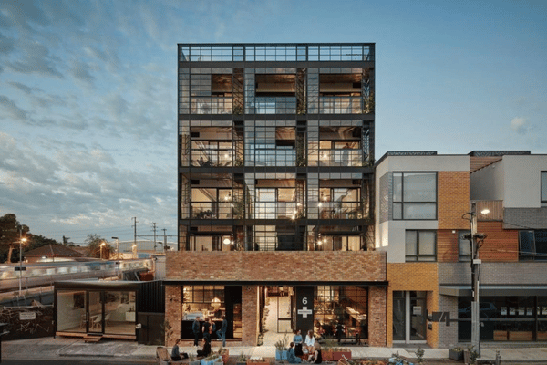 Australian high-street building with a retail shopfront on the ground floor and residential apartments above